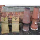 Two pairs of clay chimney pots Condition reports not available for this auction