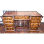 Victorian walnut inverted break-front knee-hole desk with inset leather top, 2 banks of four drawers