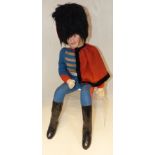 Seated figure in Hussar in uniform 29" high Condition reports not available for this auction