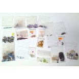 A large quantity of loose gemstones, to include melee diamonds, opals, rubies, emeralds,