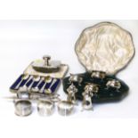 A selection of silver, to include a cased cruet set, silver candle snuffer, silver napkin rings,