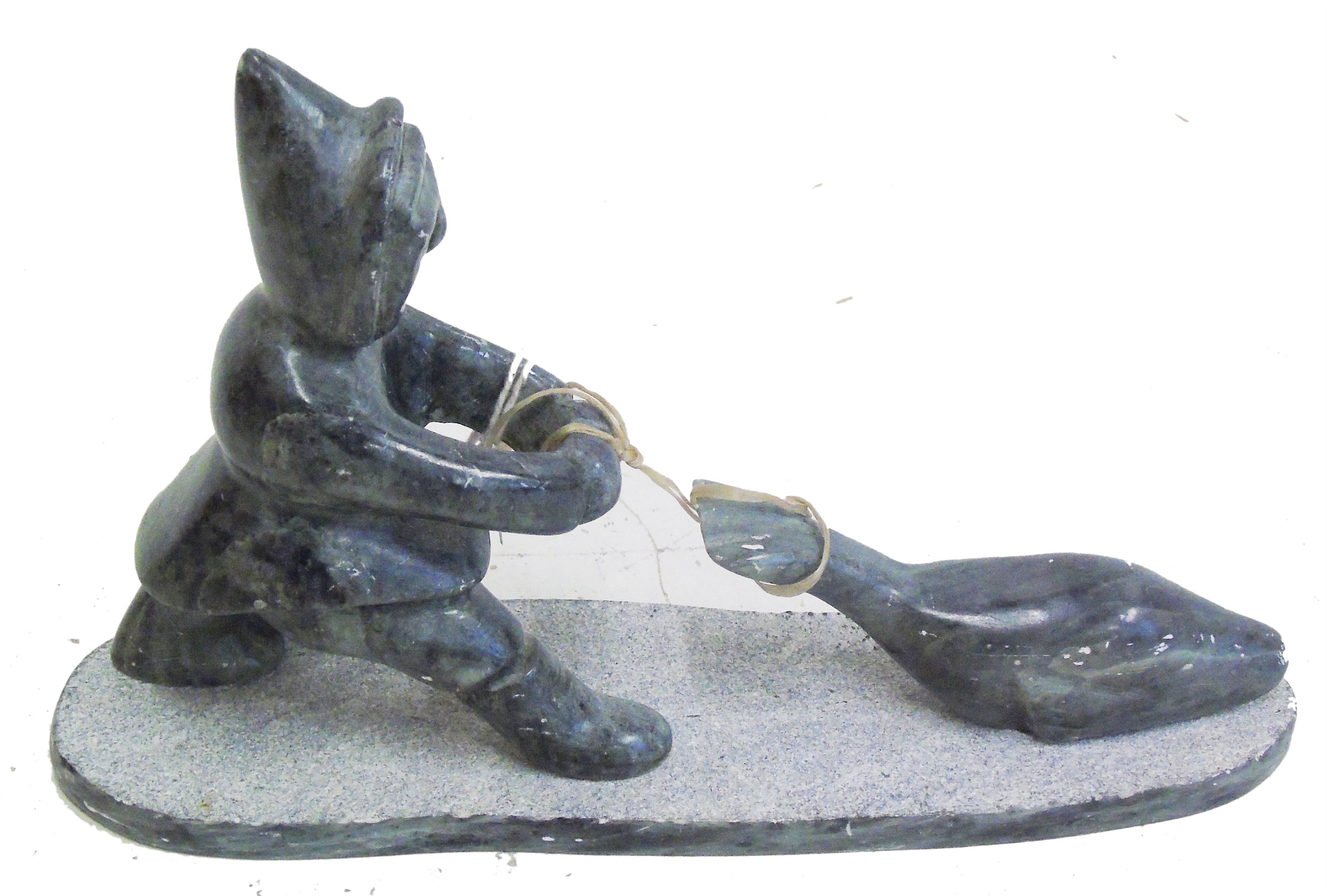 Late 20th century carved stone figure of Hunter with Fish. Condition reports not available for