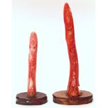 Two 20th century Japanese pink coral figures Kannon . 11cm and 8cm (including the hardwood base)