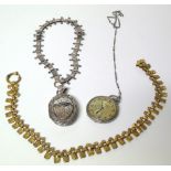 A selection of jewellery, to include a Victorian hinged locket on chain, one further chain and an