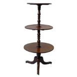 George III mahogany three tier dumb waiter, central baluster column supporting three dish turned,