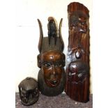 Carved African hardwood mask, hardwood panel and carving in the form of an African hut and walking