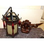 Oriental style Hexagonal hall lantern and carved mahogany door pedimen Condition reports not