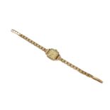 A 1960s ladies 9ct gold Tissot 'Stylist' wristwatch, the square signed gold-tone dial with baton