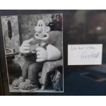 Black and white photograph of Wallace (Wallace and Gromit) with signed dedication signed by Peter