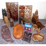 A quantity of African, Asian and Maori wall carvings and figures Condition reports not available for