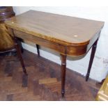 19th century mahogany fold over games table on turned and fluted legs Condition reports not