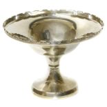 A silver tazza, of typical form, raised on a circular filled base, hallmarks for Birmingham, 1934,