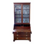 George III mahogany bureau bookcase, top section with two astragal glazed doors covering three