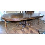 Late Victorian heavily carved oak extending dining table 113cm diameter with 3 extra leaves (each