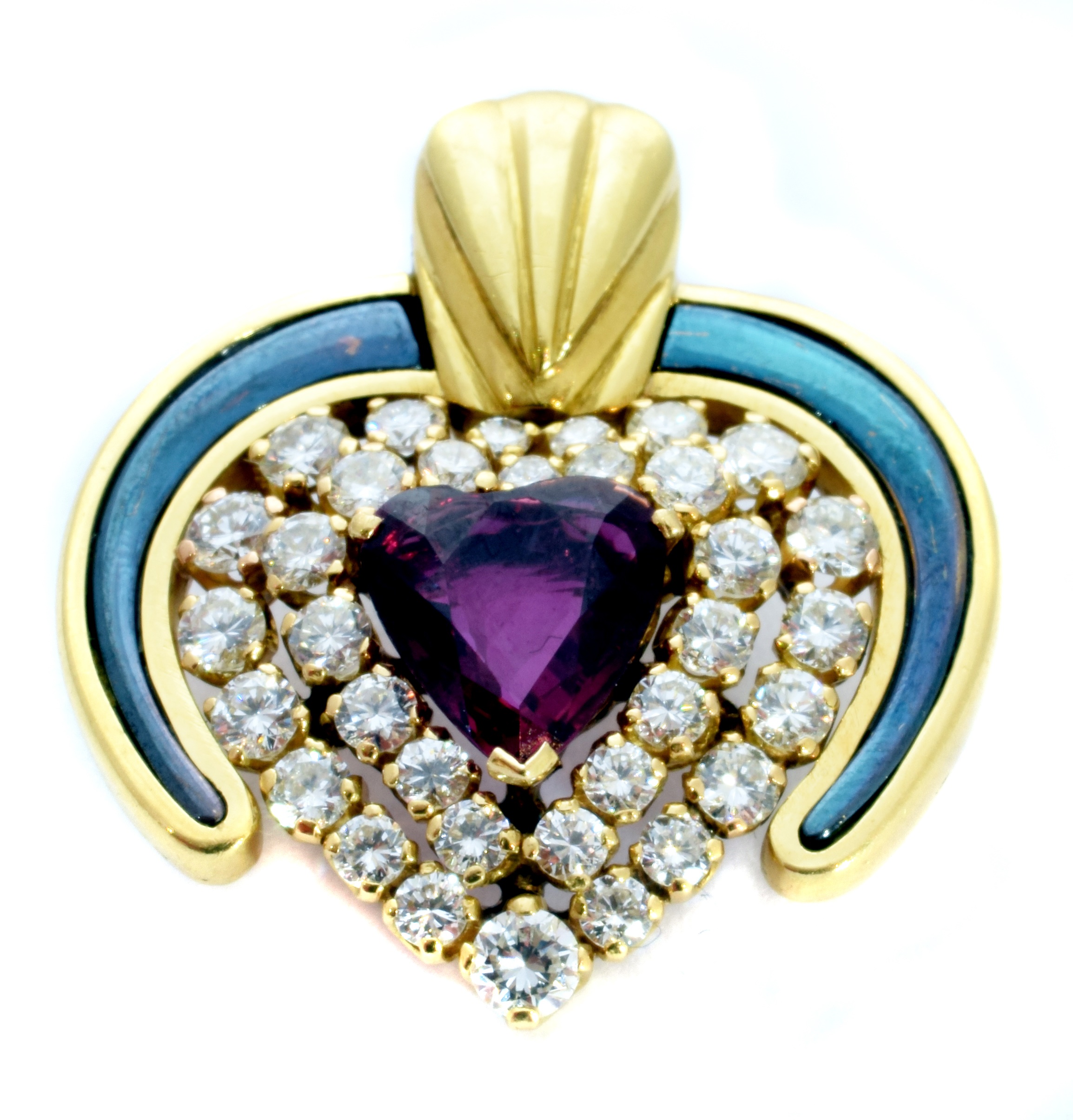 A ruby diamond and enamel heart pendant,