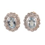 A pair of aquamarine and diamond earrings,