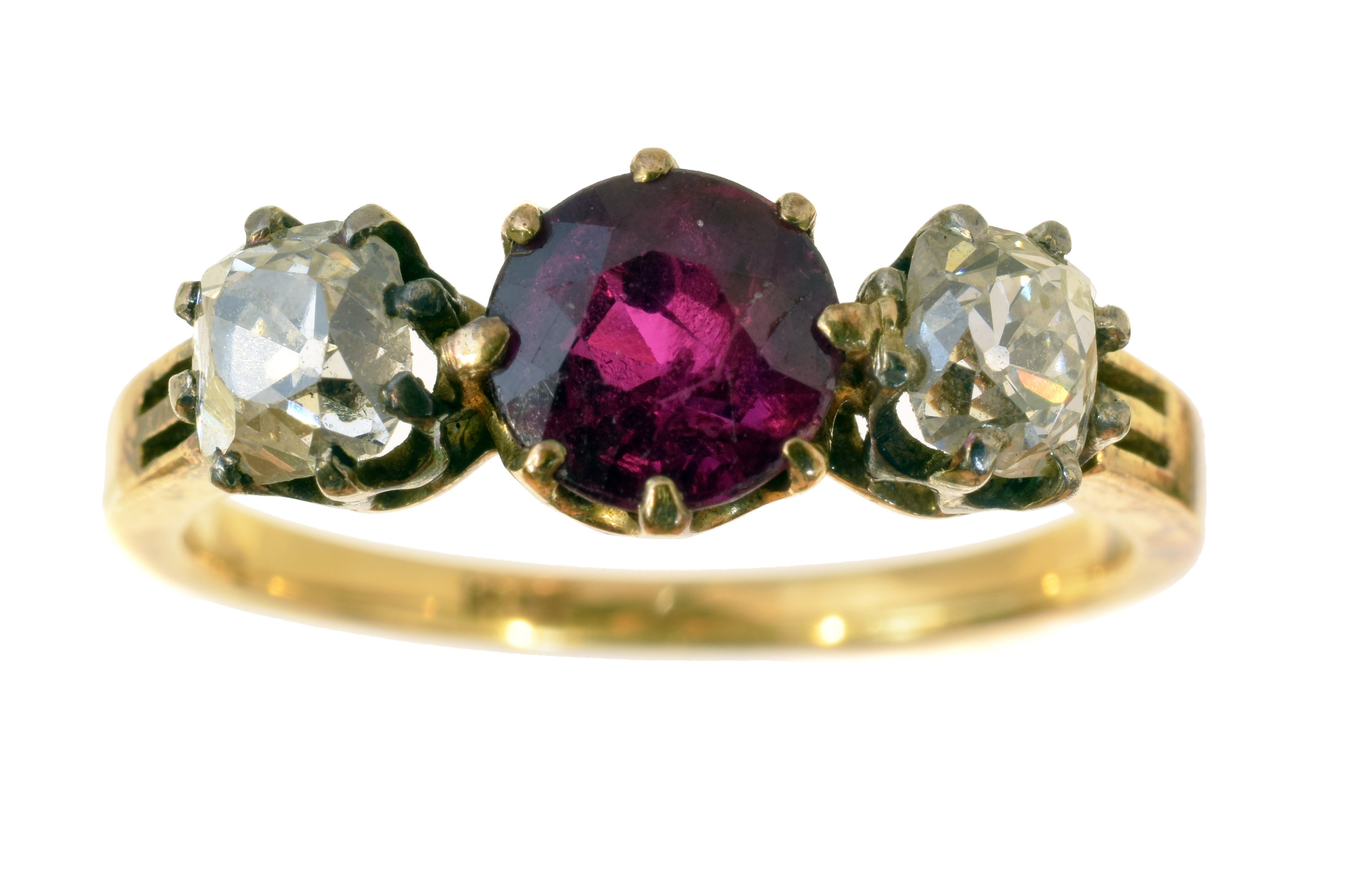 A ruby and diamond three stone ring.