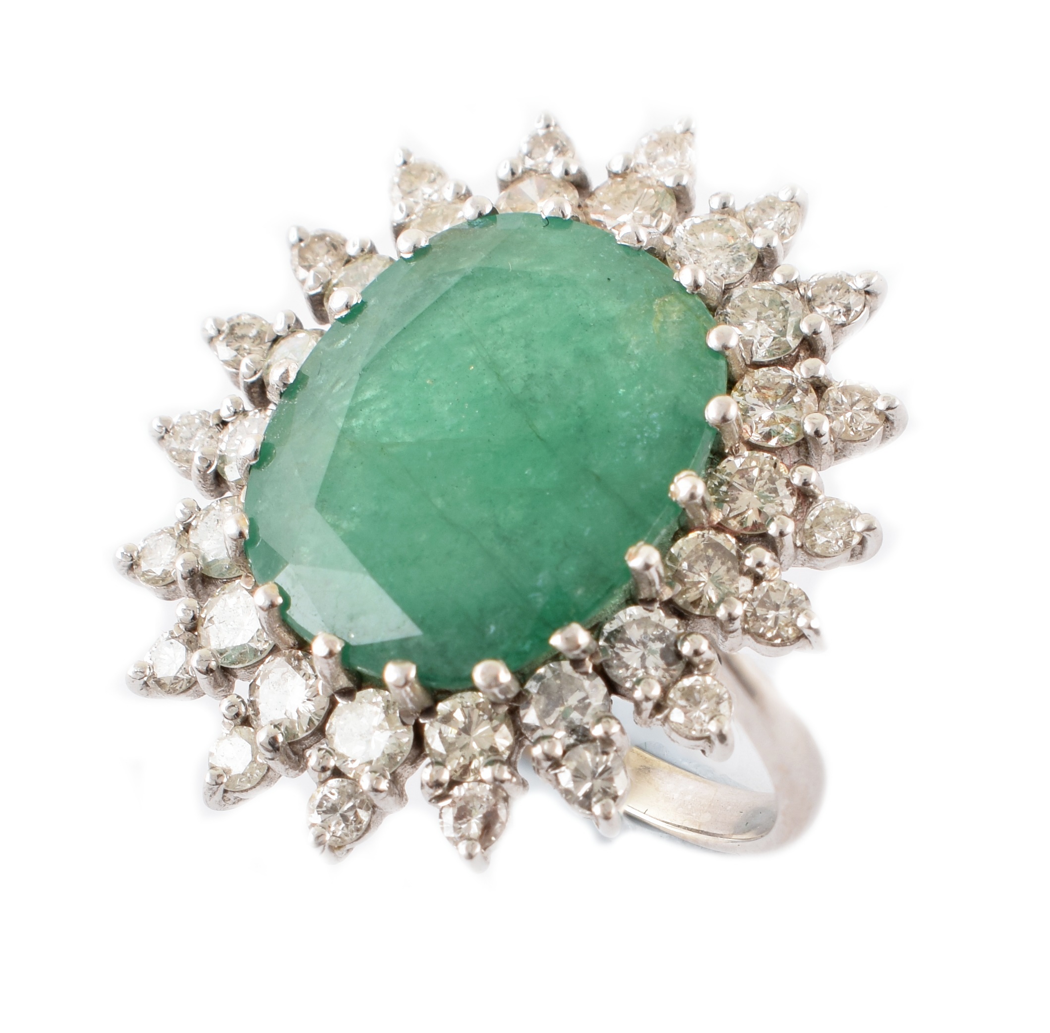 An emerald and diamond cluster ring,