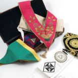 A collection of Masonic memorabilia, to include sashes, aprons and jewels, some for the