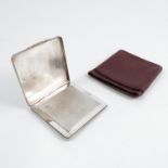 A lady's silver compact, of square form, with engine turning, gilt floral clasp, Birmingham 1947,
