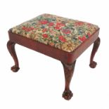 A Georgian design rectangular footstool, with upholstered top, raised on cabriole legs terminating