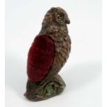 A cold painted bronze pin cushion, formed as an owl, the base bearing Bergman urn mark, numbered