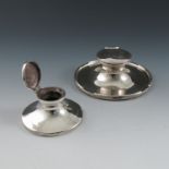 Two silver capstan inkwells, both engraved with inscriptions or initials, Birmingham marks rubbed