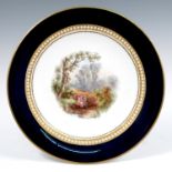 A 19th century Grainger's Worcester cabinet plate, decorated with a landscape of two figures by a