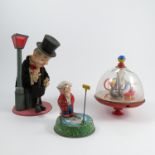A Japanese tinplate toy, of a man wearing a black evening suit and top hat, with celluloid head,