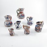 Six Masons Ironstone hydra jugs, decorated in various colours and assorted sizes and marks, together