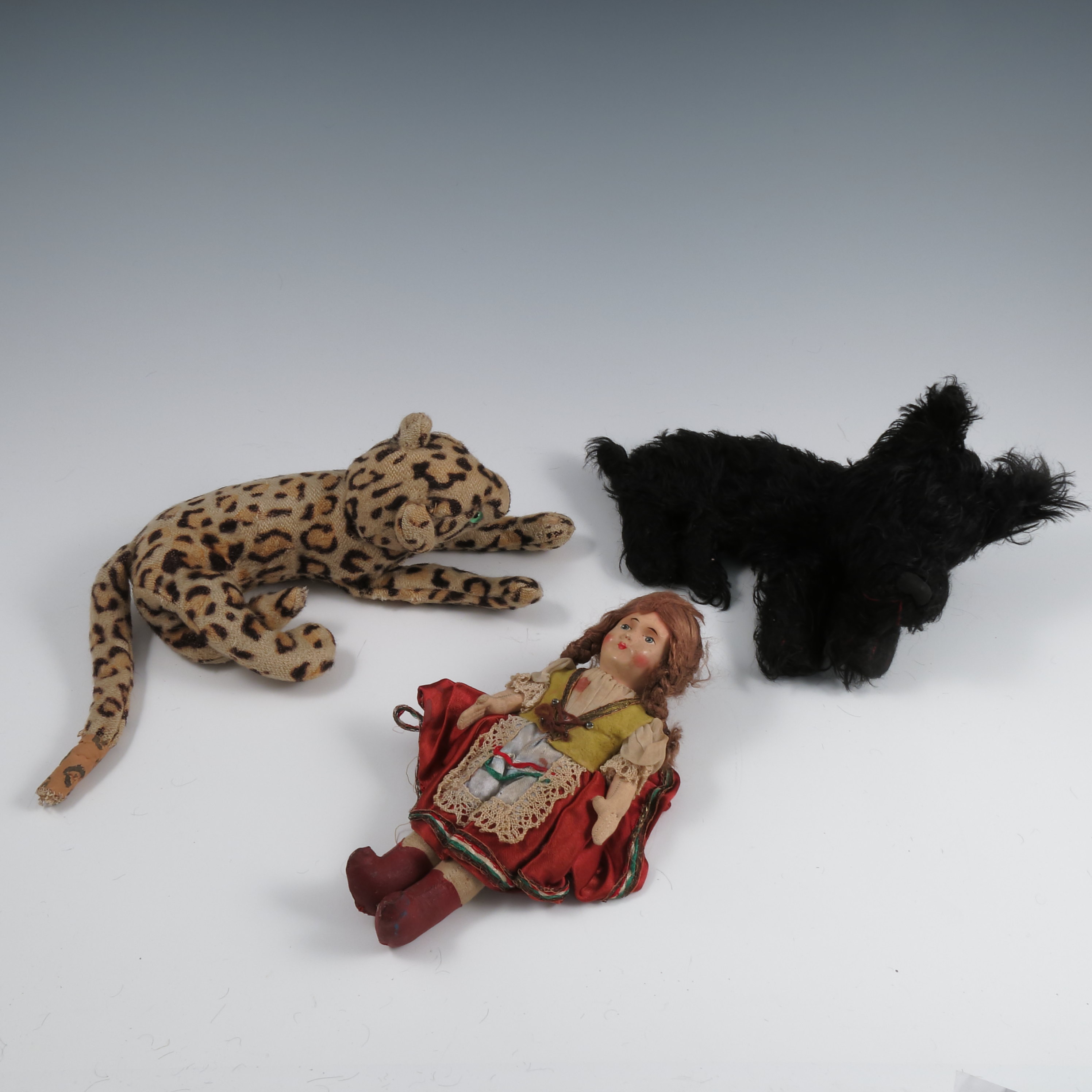 A collection of dolls, to include two with moulded heads, two costume dolls, a plush tiger, a - Image 2 of 2