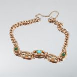 An Edwardian bracelet, of hollow curb links, with a turquoise and seed pearl set frontispiece