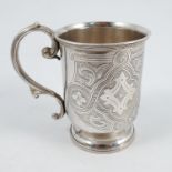 A Victorian silver christening mug, with engraved decoration and initials, scroll handle and