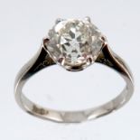 A single stone diamond ring, in a platinum mount, the old brilliant cut measuring approximately 7.