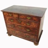 An 18th century design walnut chest of drawers, having cross banded decoration, fitted with two