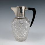 A silver mounted cut glass claret jug, with black angular handle, Birmingham 1889, height