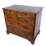 An 18th century walnut chest of drawers, fitted with two short drawers over three long drawers,