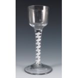 An 18th century English drinking glass, with plain bowl, having an opaque air twist stem, height