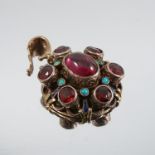 An Austro-Hungarian garnet and turquoise set pendant, with a later yellow metal back plate and