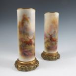 A pair of Royal Worcester vases, of cylindrical form, decorated with Stags in landscape by Harry