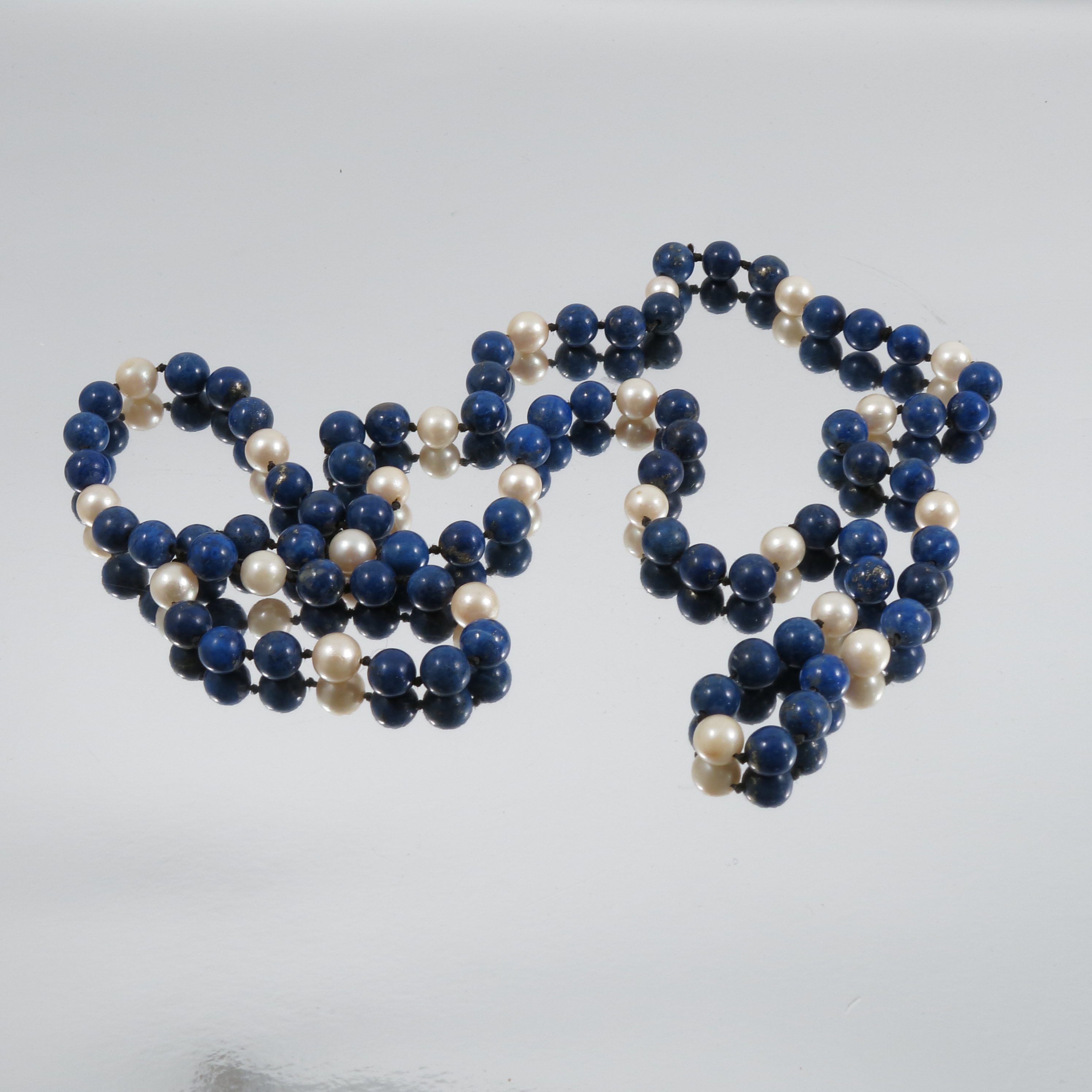 A lapis lazuli and cultured pearl necklace, 84cm long - Image 2 of 2