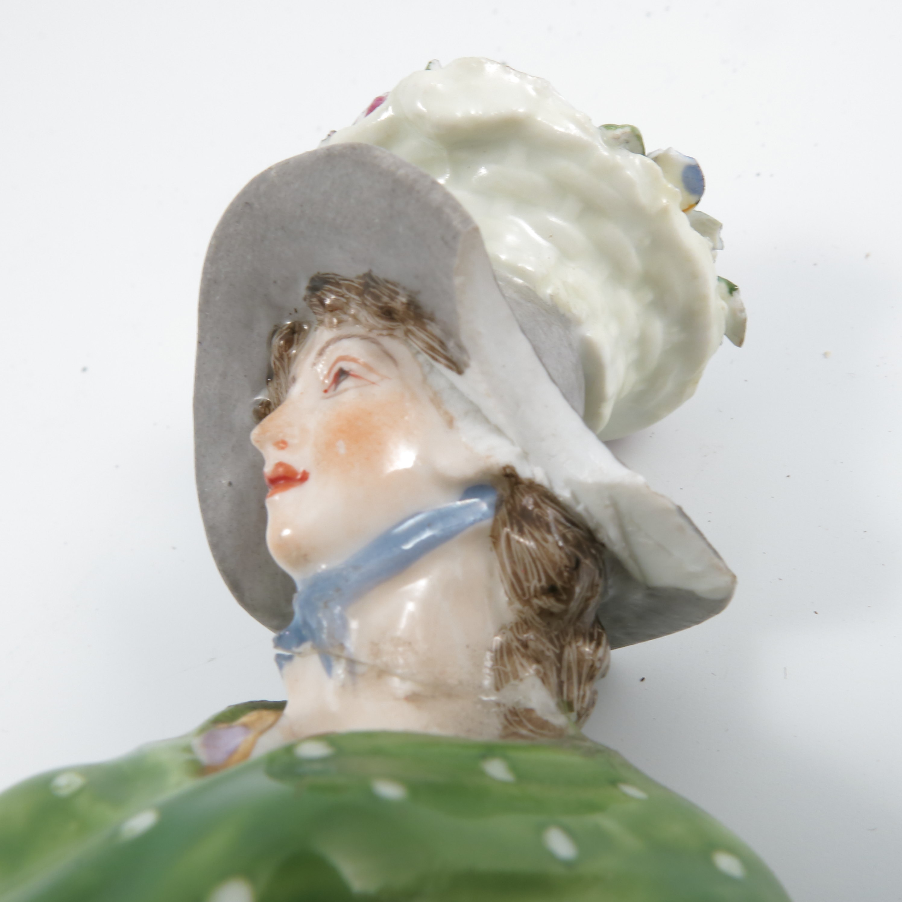 A pair of late 19th century continental porcelain figures, of a man wearing a yellow jacket and a - Image 2 of 9