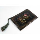 A papier mache folder cover, decorated with flowers and mother of pearl, 9ins x 6.25ins