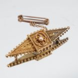 A Victorian gold locket back brooch, with later inscription, pearl to the centre (unwarranted and