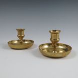 A pair of brass Brighton Bun candlesticks, of circular form, diameter 4ins