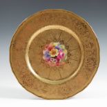 A Royal Worcester cabinet plate, the centre decorated with flowers by Freeman, to a deep acid etched