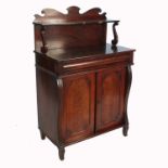 A Victorian mahogany chiffonier, fitted with a shelf to the back with scroll supports, over one long