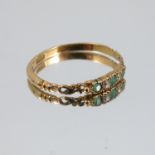 A Victorian emerald and diamond five stone ring, with open work shoulders, stamped '18ct', finger