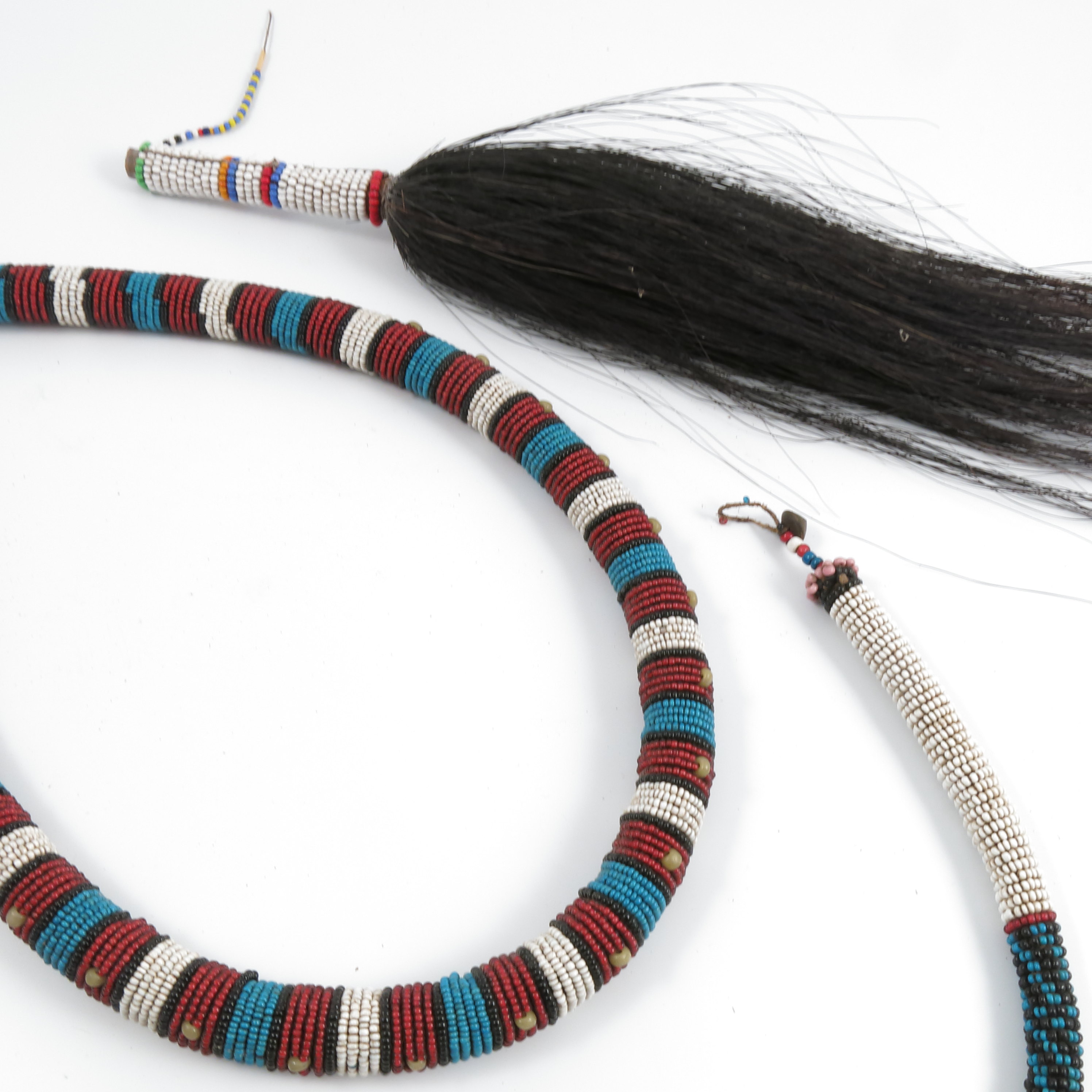 Two tribal bead work necklaces, together with a tribal bead work fly swat. - Image 2 of 3