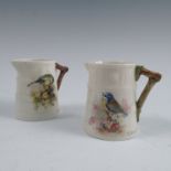 Two Royal Worcester barrel moulded jugs, painted with a Blue Tit and a Great Tit on foliage by W